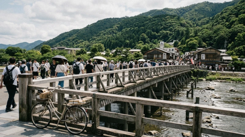 Travellers crossing Togetsukyo Bridge in Arashiyama before the Hozugawa river boat ride through the gorge